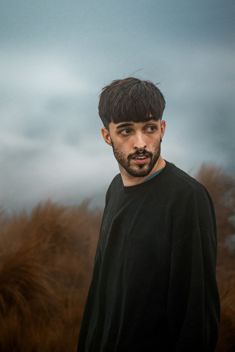 Man with a classic french crop and blunt fringe outdoors