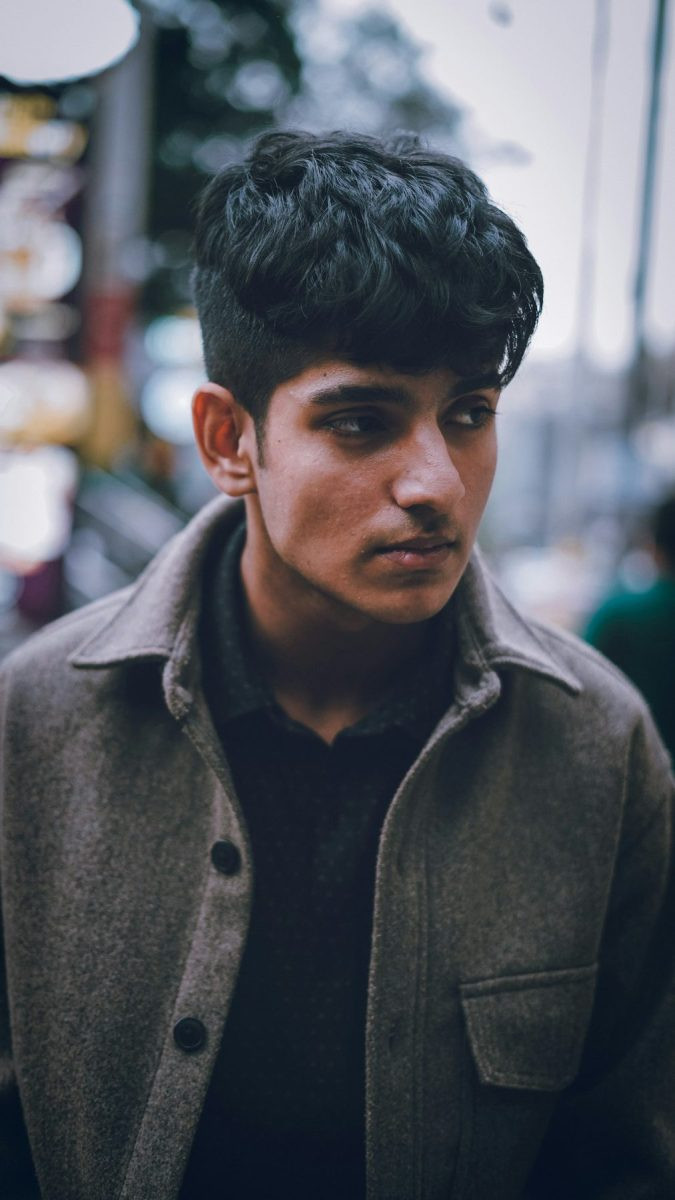 Man with a thick textured french crop and fade