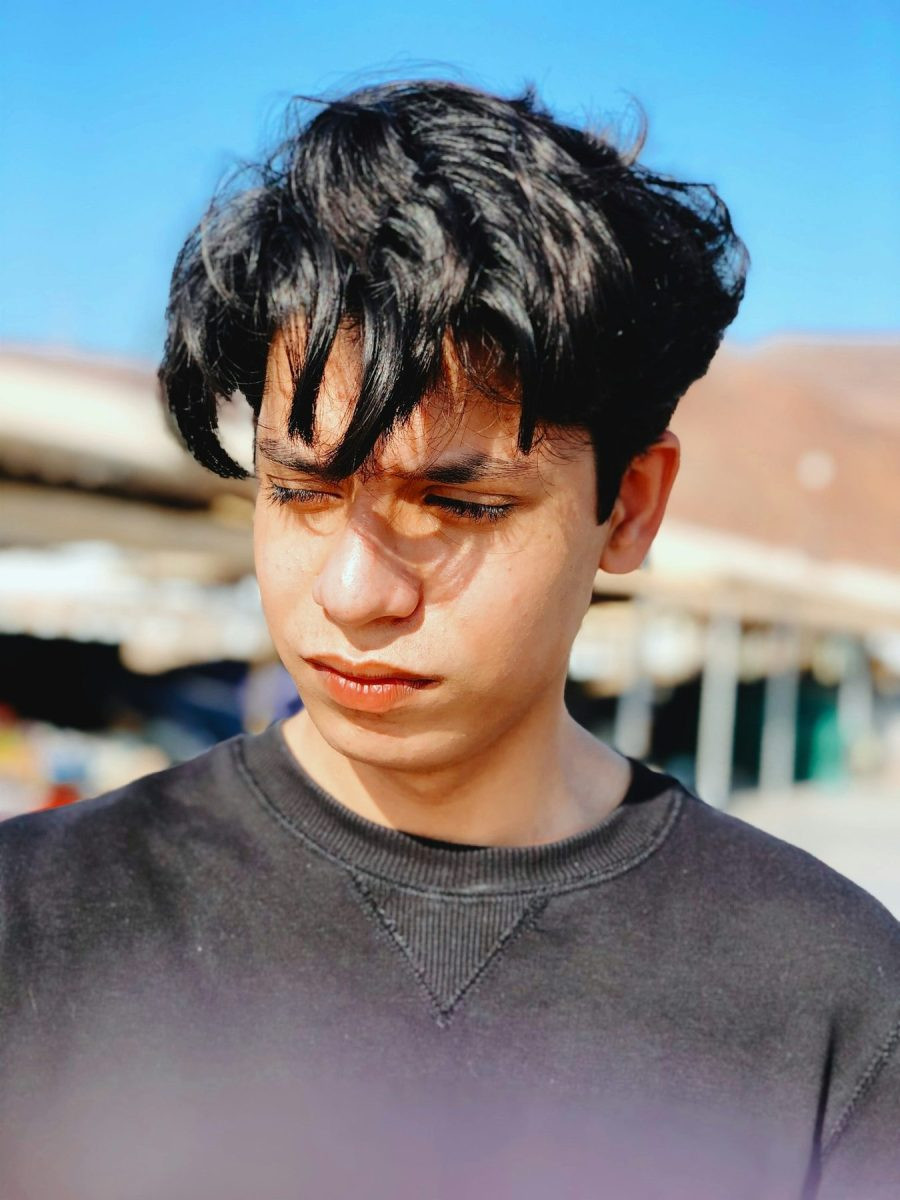 Man with a longer forward fringe french crop