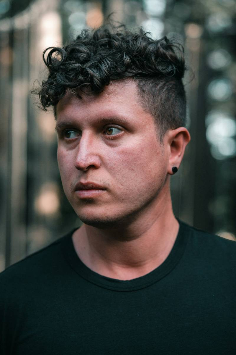 Man with a curly french crop and high fade