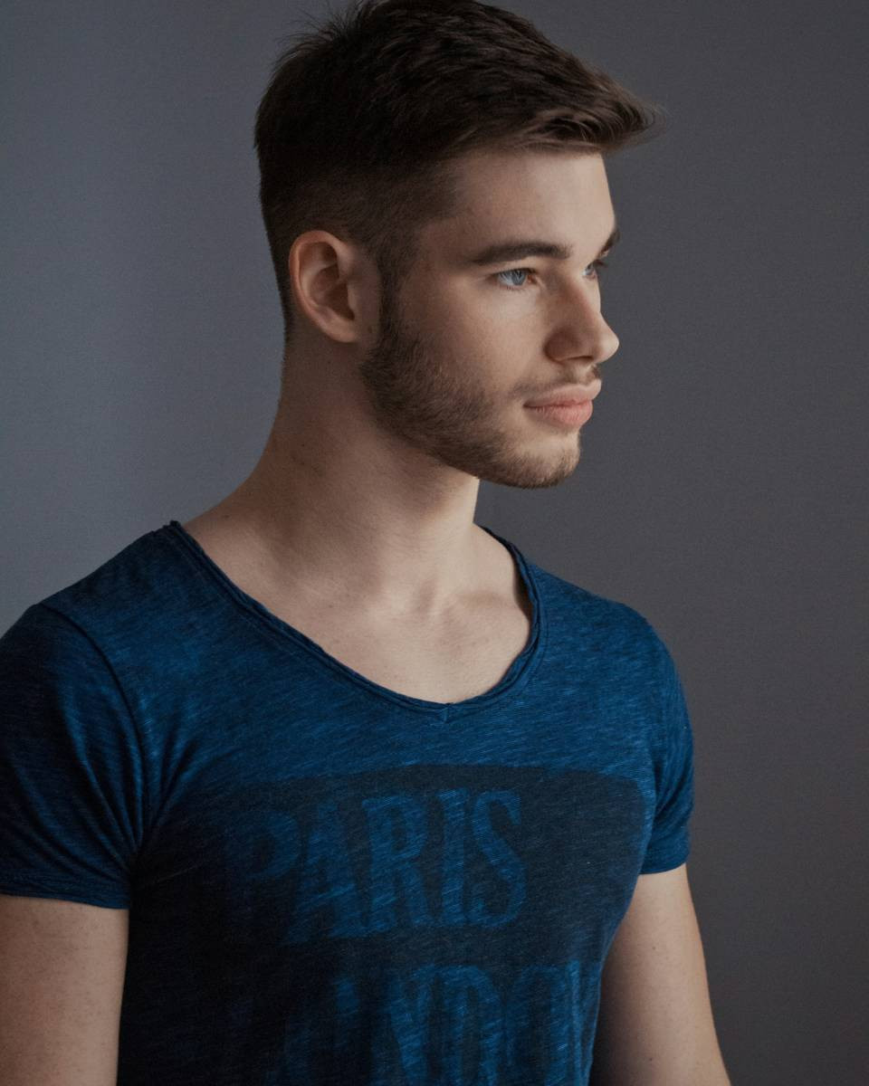Man with a french crop haircut and short beard