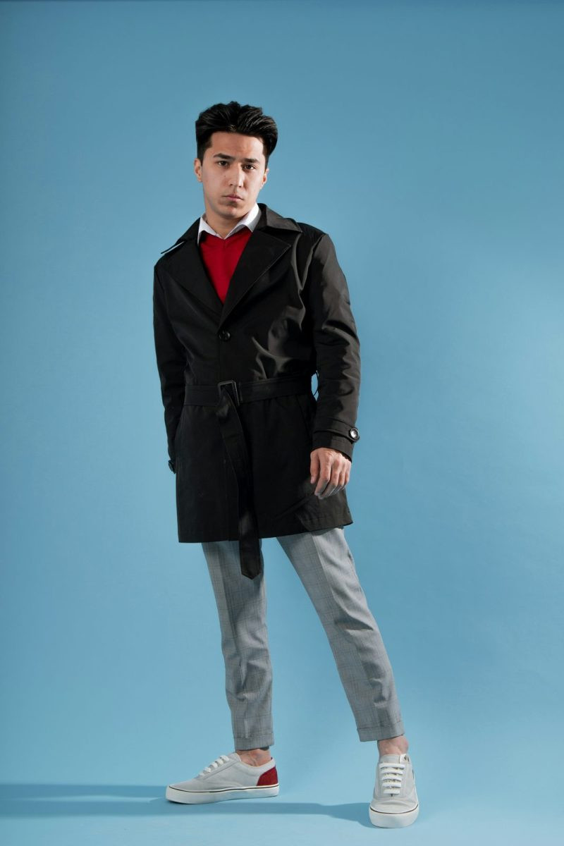 Man in a black coat with a red shirt for evening